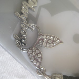 Playboy phone strap/keychain, silver bunny ears with clear rhinestones and the word Playboy across. 1.5&quot; x 1&quot;. Free shipping!