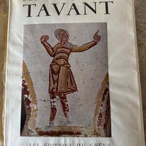 May include: A book cover with the title "LES FRESQUES DE TAVANT" in black lettering. The cover displays a fresco painting of a person in a tunic. The text "LES ÉDITIONS DU CHÊNE PARIS" is printed at the bottom of the cover.
