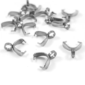 May include: A group of silver-toned metal jewellery findings, also known as jump rings, with a loop at the top. These findings are used to connect jewellery pieces together.