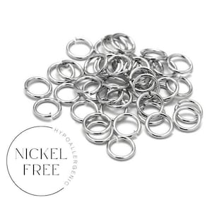 May include: A pile of silver jump rings, nickel free and hypoallergenic.  These rings are great for jewellery making and crafting.