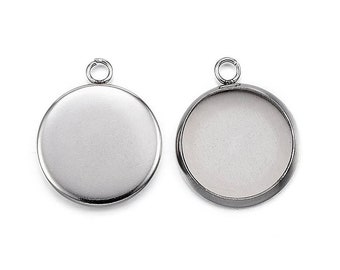 May include: Two silver round pendant trays with a loop at the top. The trays are blank and ready to be filled with resin or other materials.