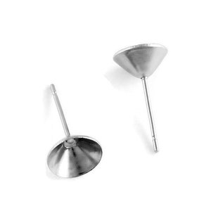 May include: Two silver earring posts with a round, slightly concave top. The posts are made of metal and have a smooth finish.