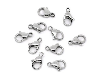 May include: Ten silver-toned lobster clasps, a type of fastener used for jewelry making.