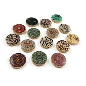 May include: Assortment of 14 round wooden beads with various colourful patterns, including animal prints, geometric designs, and floral motifs. The beads have a hole in the centre for stringing.