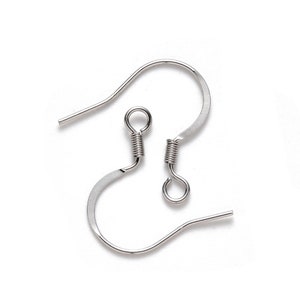 May include: Two silver earring hooks with spring-loaded closures. The hooks are made of metal and have a smooth, polished finish.