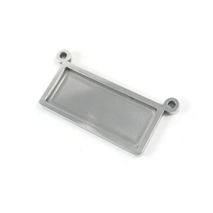 May include: A silver metal rectangular tag with two holes at the top. The tag is blank and ready to be engraved.