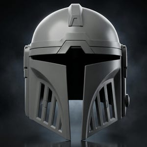 May include: A gray Mandalorian helmet with a rounded top and angular features. The helmet has a visor opening and vertical vents on the cheek pieces. A small, raised rectangular detail is on the top.