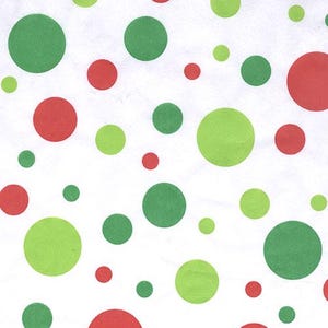 May include: White background with red and green polka dots of various sizes.
