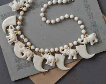 vintage 70s plastic charm necklace - African theme elephants and lion claws - retro boho costume jewelry