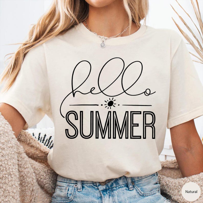 May include: A white t-shirt with black text that says "hello summer" with a sun graphic above the word "summer".