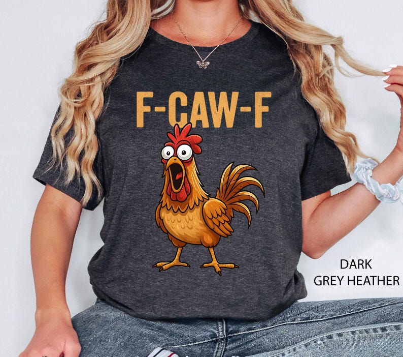 May include: Dark grey heather t-shirt with the text "F-CAW-F" in gold letters above a cartoon rooster with an open beak. The rooster is brown, orange, and red.
