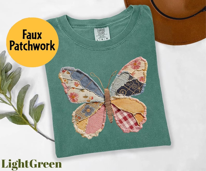 May include: Light green t-shirt with a faux patchwork butterfly design. The butterfly wings are made of various fabric patterns, including floral, denim, and gingham. The shirt also has the text "Faux Patchwork" and "LightGreen".