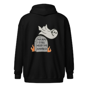 May include: Black hooded sweatshirt featuring a white ghost flying over a tombstone that reads "Ma'am's I still need the address" with orange flames on either side of the tombstone.