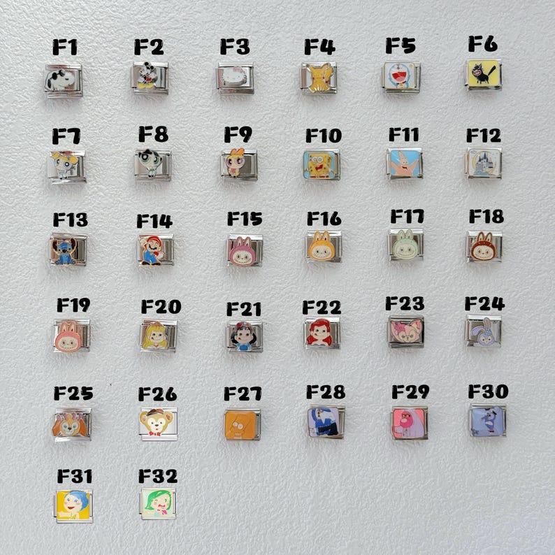 May include: A collection of 32 square charms with various cartoon character designs. Each charm is set in a silver-colored metal frame. The charms feature characters like Mickey Mouse, Pikachu, and SpongeBob.