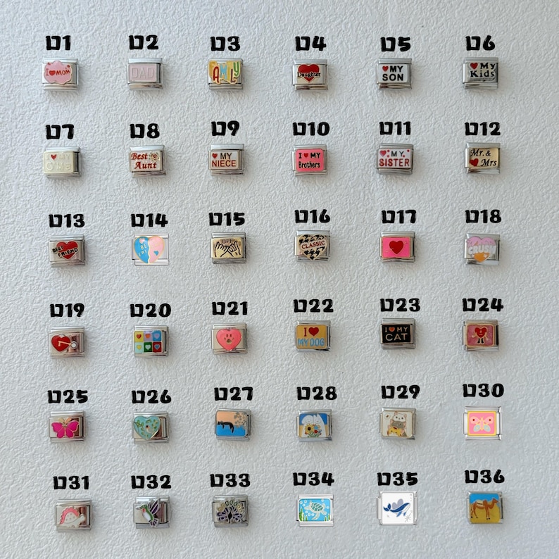 May include: A collection of silver-toned charm beads with various designs and text. The charms feature phrases like "Mom," "Dad," "My Son," and "I Love My Cat." Other charms have images of hearts, butterflies, and other symbols.