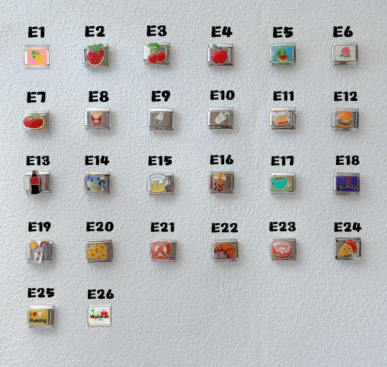 May include: A collection of silver-toned charms with colorful food and drink designs. Charms include a pineapple, strawberry, cherries, apple, watermelon, peach, tomato, french fries, ice cream, and a hamburger.