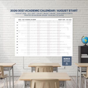 May include: A large academic calendar for 2026/2027, starting in August, is displayed on a white brick wall. The calendar is printed on thick matte paper and includes the text "2026/2027 Academic Calendar / August Start". The image also shows school desks and a globe.