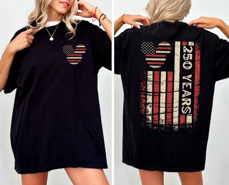 May include: Black t-shirt with a patriotic design. The front shows a Mickey Mouse-shaped design with the American flag. The back features a larger flag design with the text "250 YEARS".