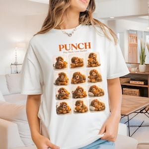 May include: White t-shirt with a grid of monkey and teddy bear illustrations. The orange text reads "PUNCH" above "Play Hard. Love Harder."