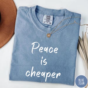 Comfort Colors® Peace is Cheaper Shirt, Retro Peace Quote Tee, Anti War Graphic Shirt, Vintage Hippie T-Shirt, Gift for Activist