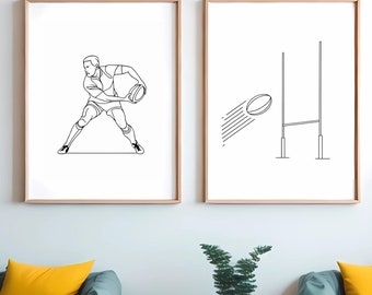 May include: Two black and white line art prints of a rugby player and a rugby goal post. The prints are framed in natural wood and hung on a white wall above a teal couch with yellow pillows.