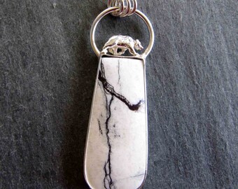 Pendant of White Buffalo Turquoise and Bear in Sterling Silver