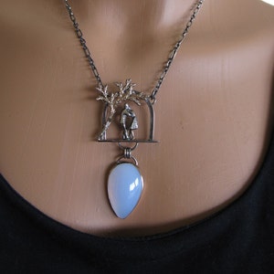 The Kiss, a Sculptural Necklace in silver and bronze with blue chalcedony