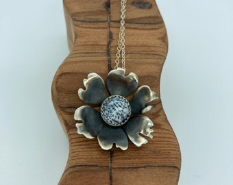 Silver flower pendant with dendrite opal center