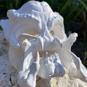 May include: A rustic wooden sign with the text "Welcome to our home" in white lettering. The sign features a distressed finish and a simple, inviting design, perfect for entryway decor.