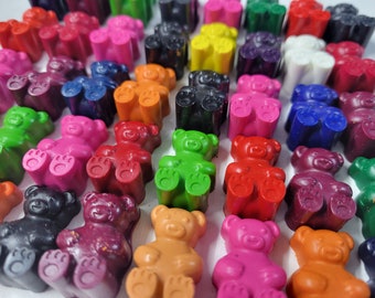 May include: A collection of colorful, bear-shaped crayons in various shades, including red, green, blue, and orange. The crayons are arranged closely together, creating a vibrant and playful display. These crayons are perfect for children's art projects.