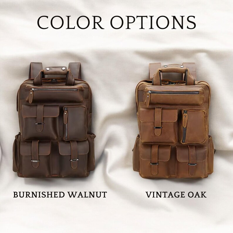 May include: Two leather backpacks in different colors. The backpack on the left is a dark brown color and is labeled "Burnished Walnut". The backpack on the right is a light brown color and is labeled "Vintage Oak".