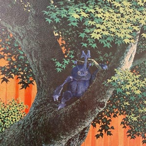 May include: A blue beetle with a long horn sits on a tree branch. The tree is in a garden setting with a red fence and green foliage.