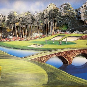 May include: A detailed painting of a golf course scene. A stone bridge arches over a blue water feature. Golfers are on the green, and trees and sand traps are visible. The sky is blue with clouds.