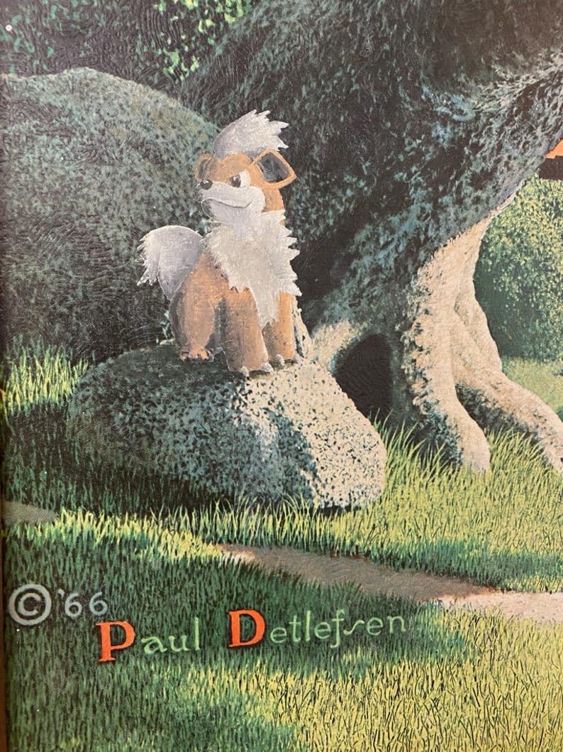 May include: A brown and white furry Pokemon character, known as Growlithe, is sitting on a large rock in a forest setting. The background features a large tree trunk and green grass. The image is signed "&copy;'66 Paul Detlefsen".