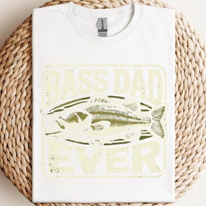 a white t - shirt with a picture of a fish on it