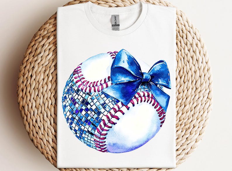 a t - shirt with a baseball and a bow on it