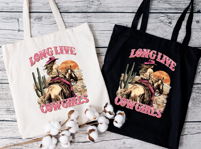 two long live cowgirls bags sitting on a table