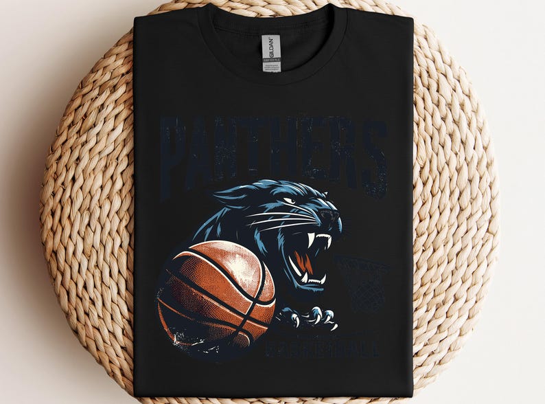 a black t - shirt with a panther holding a basketball