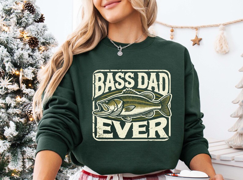 a woman wearing a green bass dad sweatshirt