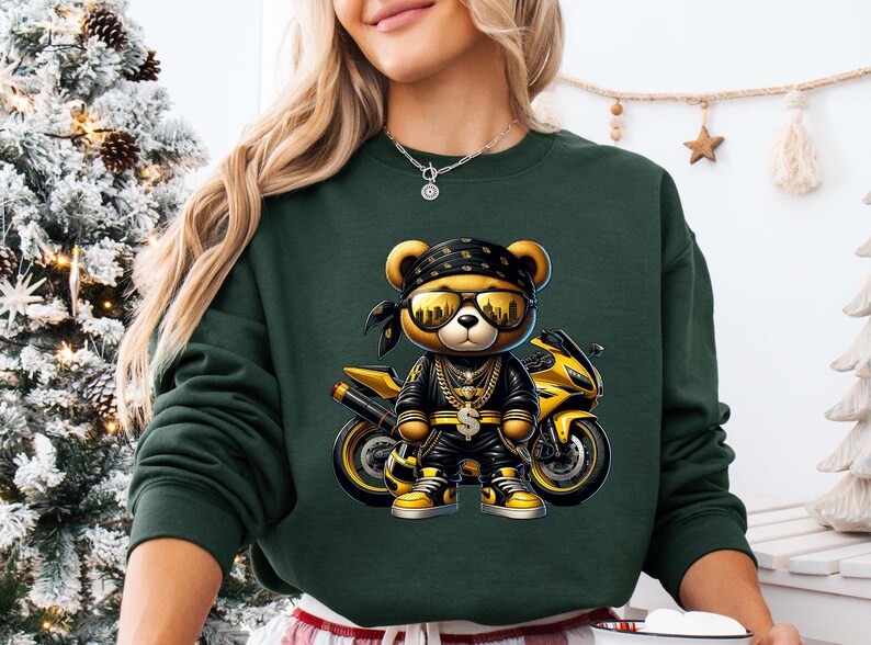 a woman wearing a green sweatshirt with a picture of a teddy bear on it