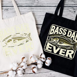 two bags that say bass dad ever and a cotton bag with a fish on it