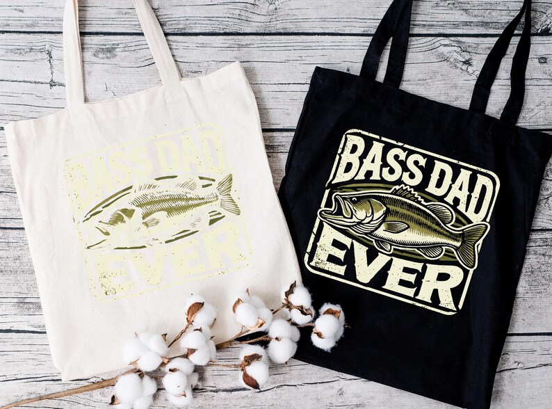two bags that say bass dad ever and a cotton bag with a fish on it