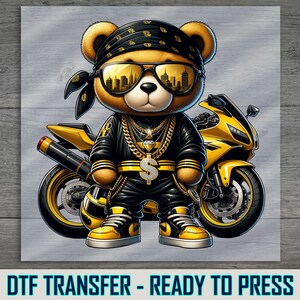 a picture of a teddy bear sitting on a motorcycle