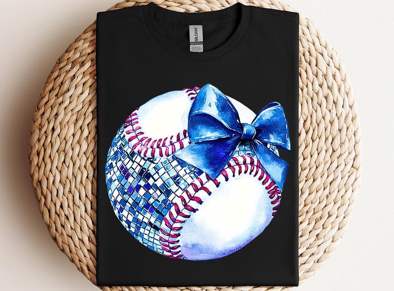 a t - shirt with a baseball and a bow on it