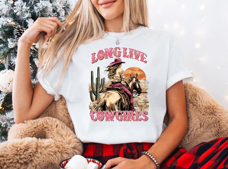 a woman wearing a long live cowgirl t - shirt