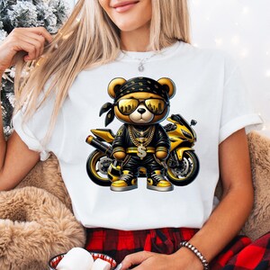 a woman wearing a t - shirt with a teddy bear on it