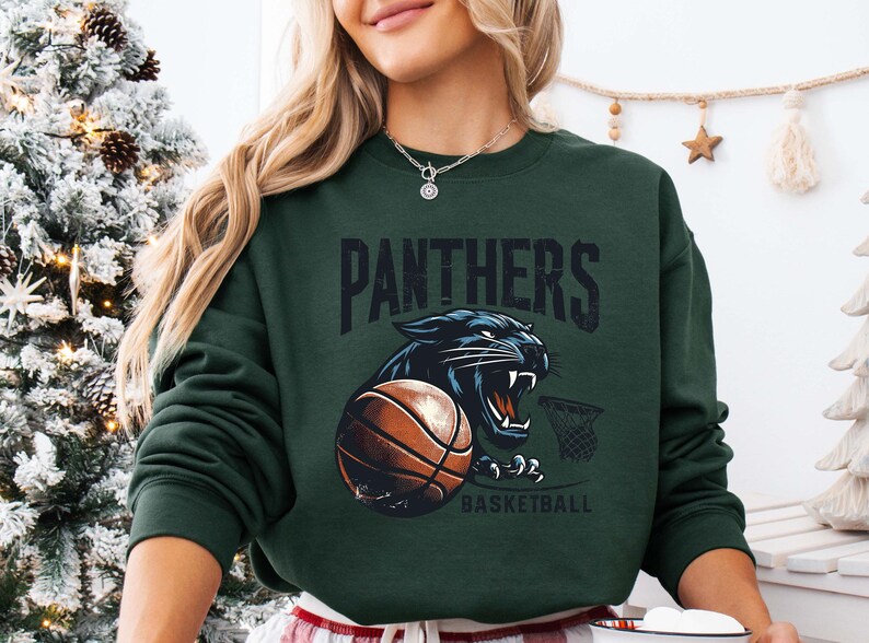 a woman wearing a sweatshirt with a panther on it