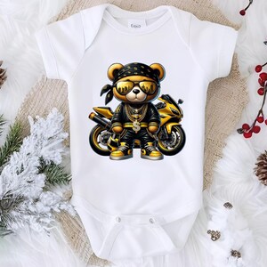 a baby bodysuit with a teddy bear riding a motorcycle
