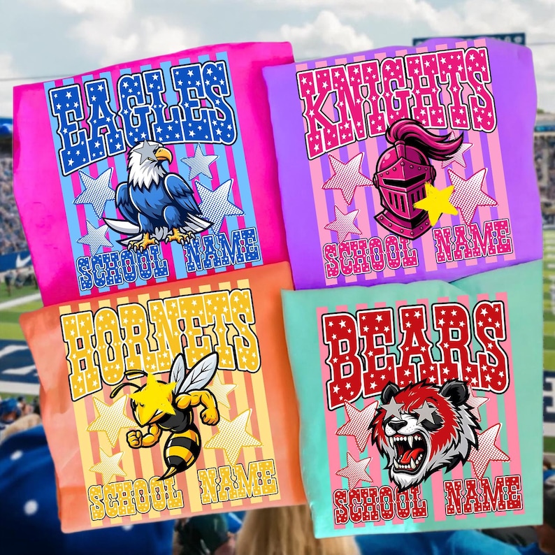 May include: Four colorful t-shirts with school mascot designs. The shirts feature the words "EAGLES", "KNIGHTS", "HORNETS", and "BEARS" with corresponding graphics of an eagle, knight's helmet, bee, and bear. Each shirt has the text "SCHOOL NAME".