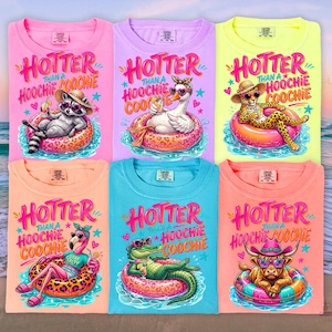 May include: Six colorful t-shirts with the text "HOTTER THAN A HOOCHIE COOCHIE" and illustrations of animals relaxing in inner tubes. The animals include a raccoon, goose, cheetah, flamingo, alligator, and a bull. The shirts are in various colors.